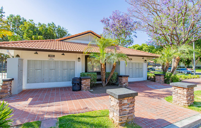 A house with a red tiled roof and a white garage door.