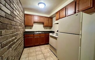 Cozy One Bedroom Apartment! Exposed Brick, Off-Street Parking & More! Call Today!