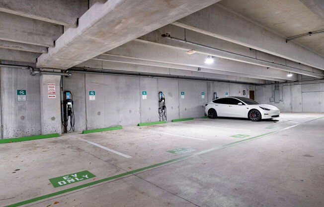 a white car parked in a parking garage