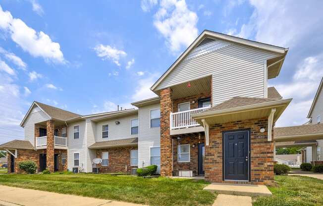 the view of an apartment building with a blue door