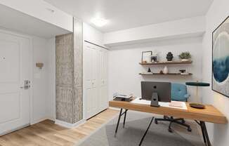 A room with a desk and a chair.