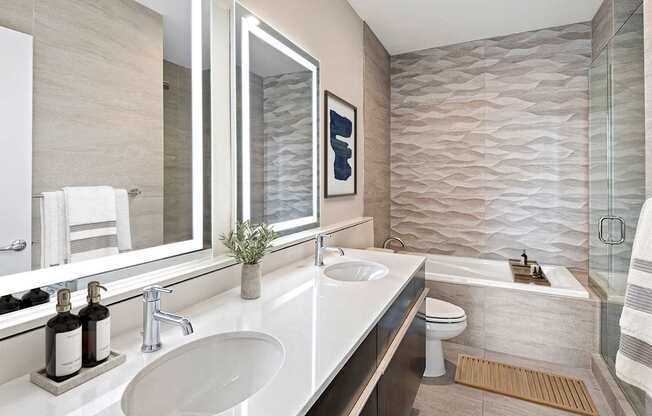 A bathroom with a white sink and a mirror above it.