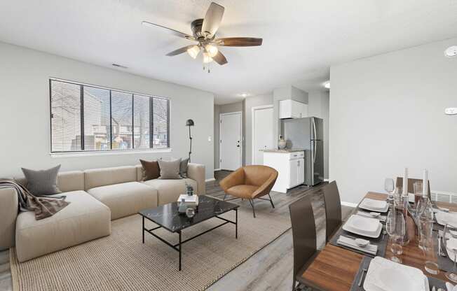 Living room and dining room view with furniture at Eddingham in Lawrence, KS