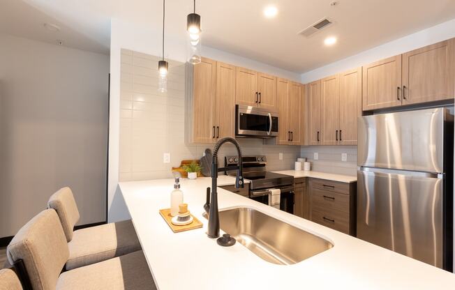 a kitchen with wooden cabinets and a white counter top