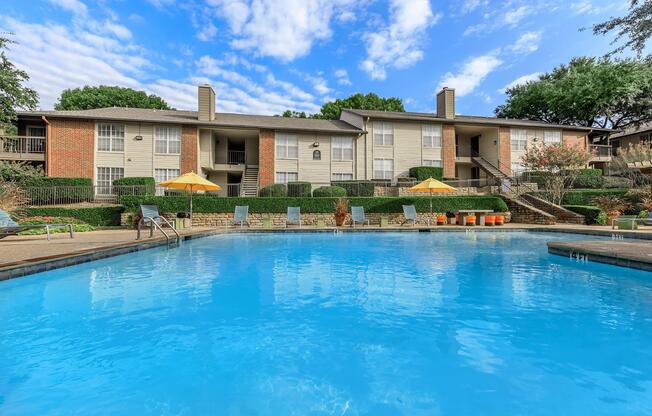 community pool with blue chairs