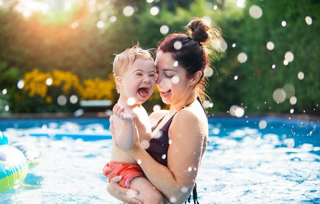 a little girl in a pool of water