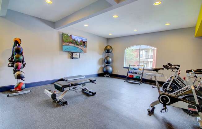 a home gym with weights and exercise equipment