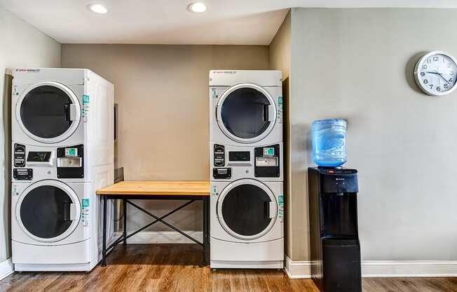 Laundry facility at Ashton Brook Apartments, featuring washers and dryers.