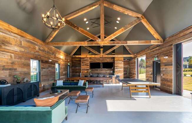 A wooden log cabin interior with a large open floor plan.