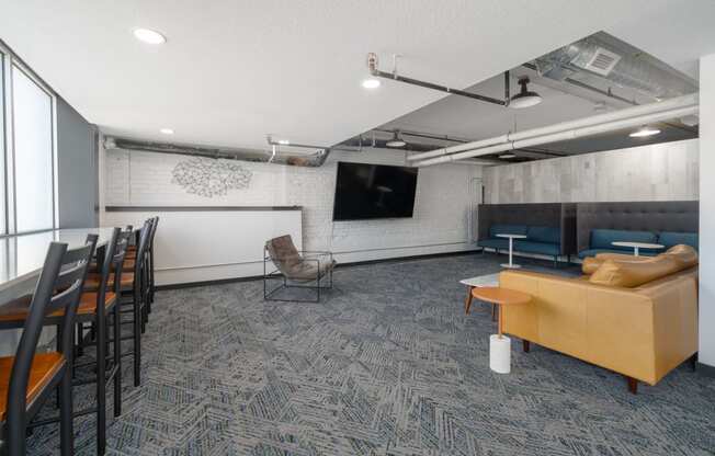 a room with a couch chairs and a table