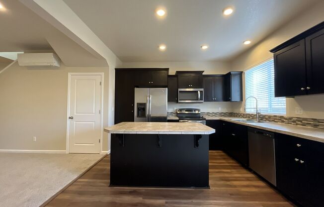 Stylish 3-Bedroom Bethany Residence with Open-Concept Living, Fenced Yard, and Attached Garage