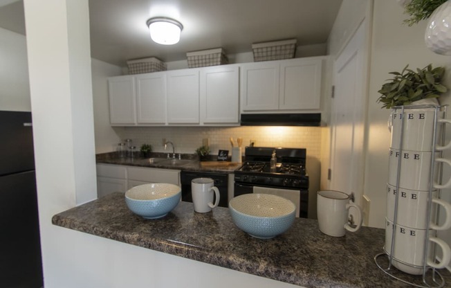 This is a photo of the kitchen in the 740 square foot 1 bedroom model apartment at Compton Lake Apartments in Mt. Healthy, OH.