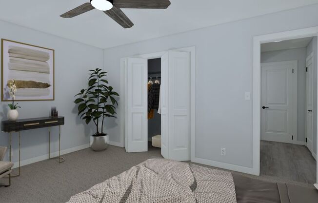 a bedroom with two closets and a bed and a ceiling fan