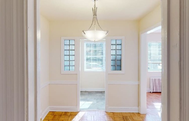 view through hallway to kitchen and living area at 4031 davis in glover park washington dc