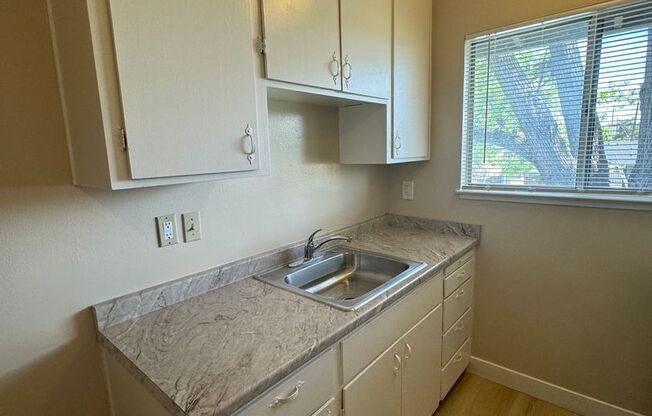 Upstairs 1 bedroom 1 bath apartment w/ assigned parking!