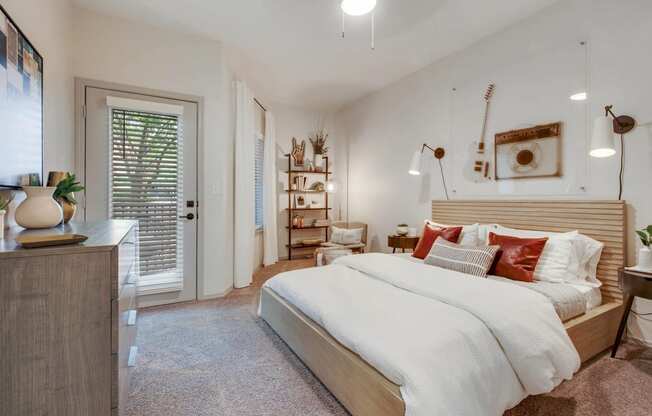 a bedroom with a bed and a door to a closet at The Olivine, Austin, Texas