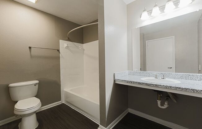 bathroom with vanity mirror in west houston luxury apartments