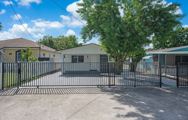 Fully renovated stylish 3 bed 2 bath home featuring a luxury kitchen, modern appliances on a fenced lot with parking!