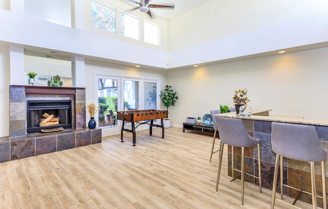 a living room filled with furniture and a fireplace