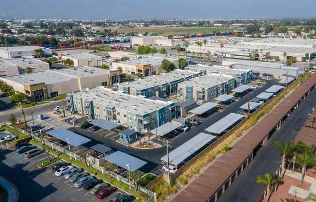 an aerial view of a city with several apartment buildings and a parking lot at Loma Villas Apartments, San Bernardino, 92408