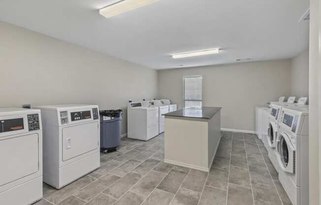 the laundry room at the preserve at green valley falls apartments