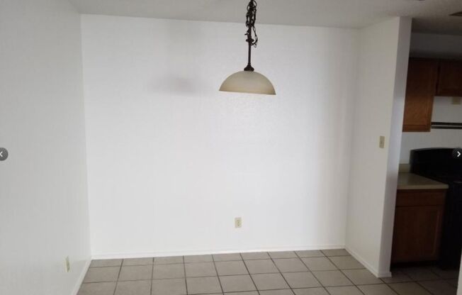 Open Concept, Wood burning fireplace with Ceramic Flooring