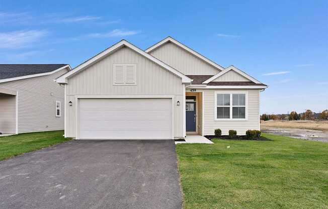 A two-story house with a garage is shown.