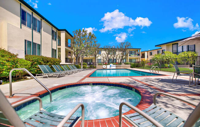 our apartments have a large hot tub and a pool with chairs at Casa Del Amo Apartments, California, 90505