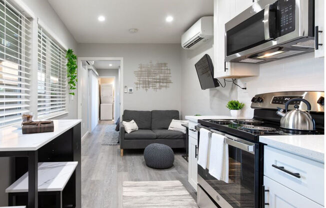 a small living room with a kitchen and a couch at Element LLC, Sunnyvale, 94086