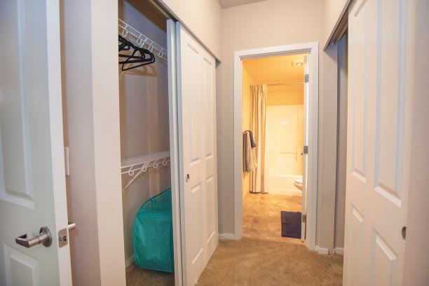 Ensuite Bedroom With Double Closet at Metropolitan Place Apartments, Renton, Washington