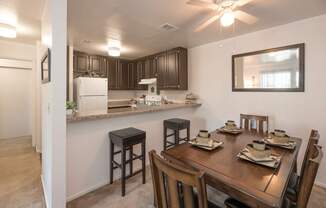 A kitchen with a table set for four at Sierra Glen Apartments, California, 95621