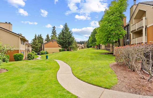 A residential area with a pathway and houses.