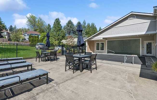outdoor seating area with chairs and umbrellas