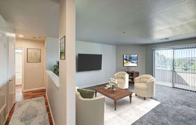 A living room with a flat screen TV and a balcony.