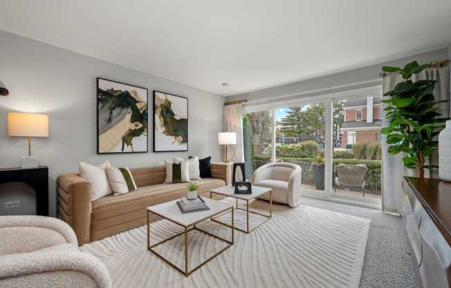 A living room with a white sofa, a coffee table, and a fireplace.