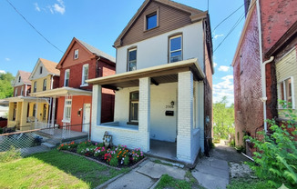 Updated flooring, finished basement, and great outdoor space in a walkable Swissvale location