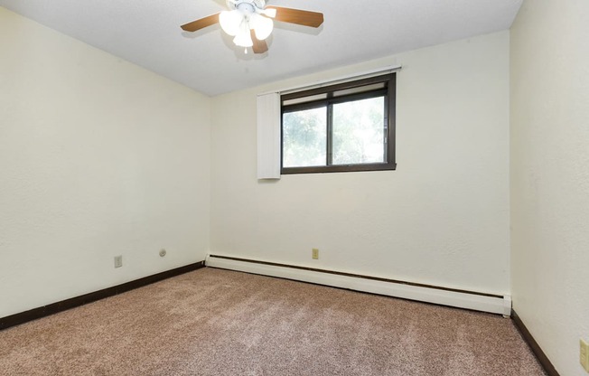 White Bear Lake, MN White Bear Terrace Apartments.  a bedroom with a ceiling fan and a window