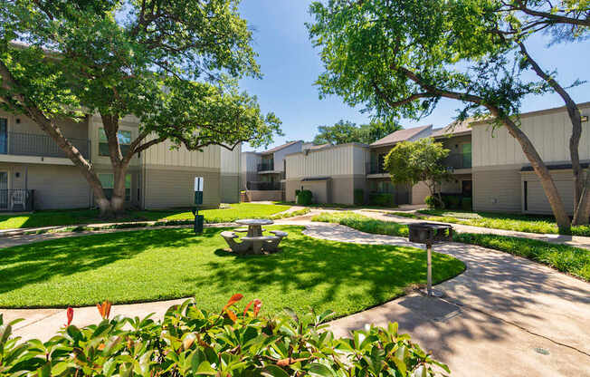 Building exteriors and grounds at The Biltmore Apartments located in the Vickery Midtown neighborhood of Dallas, TX.
