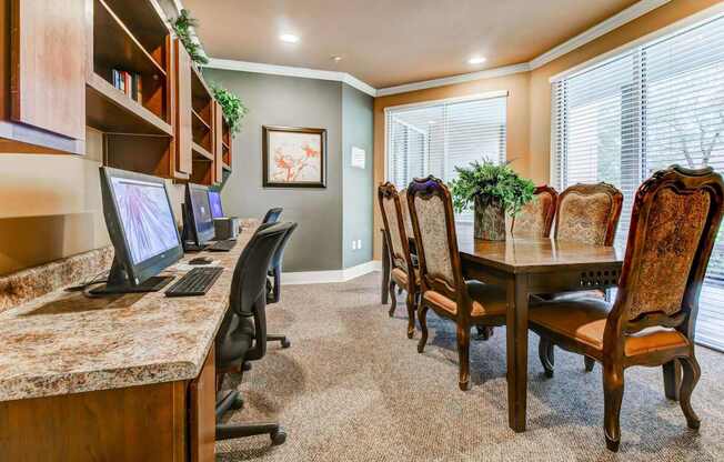 Business Center with conference table and computers