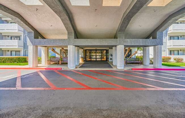 a view of the entrance to the building from the parking lot