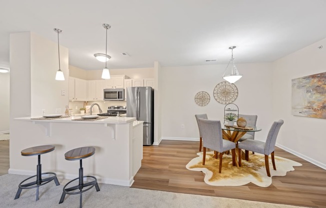 a kitchen and dining room in a 555 waverly unit