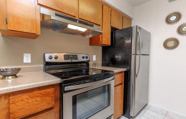 a stove top oven sitting inside of a kitchen