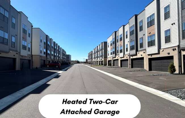 an empty street with rows of apartment buildings on both sides t Meridian at CityPlace, Woodbury, MN 55125