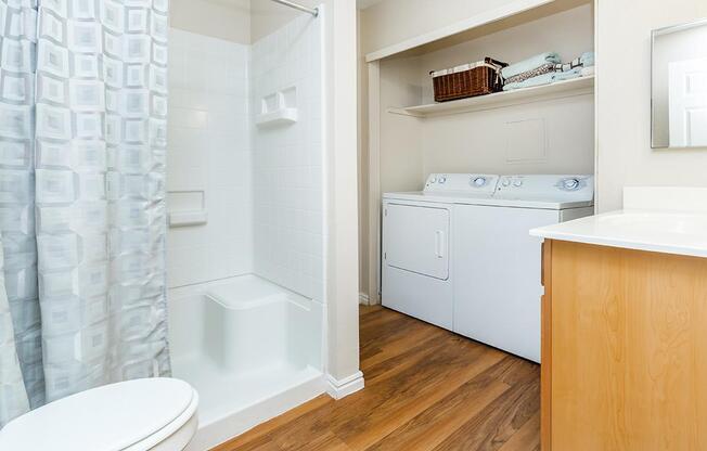 a large white tub next to a sink