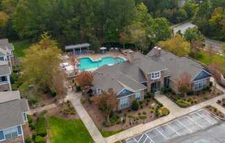 A large house with a pool in the backyard.