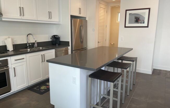 Water views! Less than a block from the ocean! 2 Bed 2.5 Bath Townhome!