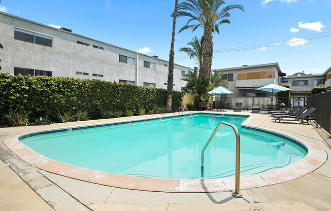 One of two large gated pools and lounging area.