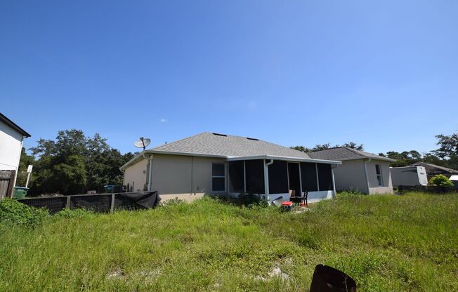 This charming 4 Bedroom, 2 Bath Single Family Home For Rent at 3785 Trade St. Deltona, FL 32738