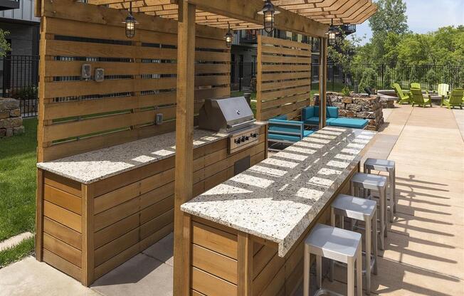 Be @ Axon Green  Grill Area with Granite Counter Tops and Bar stools