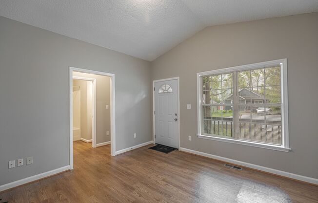 Like New Home off Freeman Mill.  Just Painted, New Wood/Vinyl Flooring, Vaulted Ceilings, Front Porch and Deck!